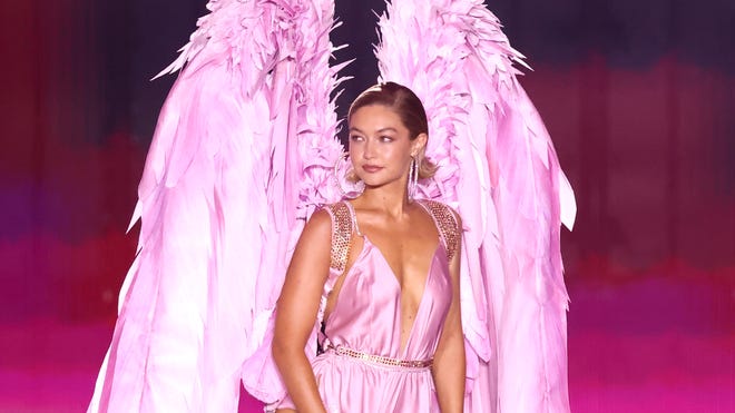 Gigi Hadid showcasing pink angel wings at Victoria's Secret Fashion Show